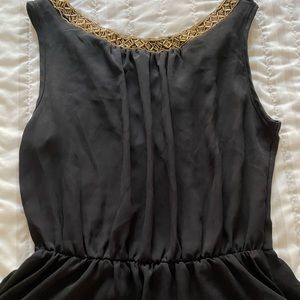 Embellished black peplum sleeveless top